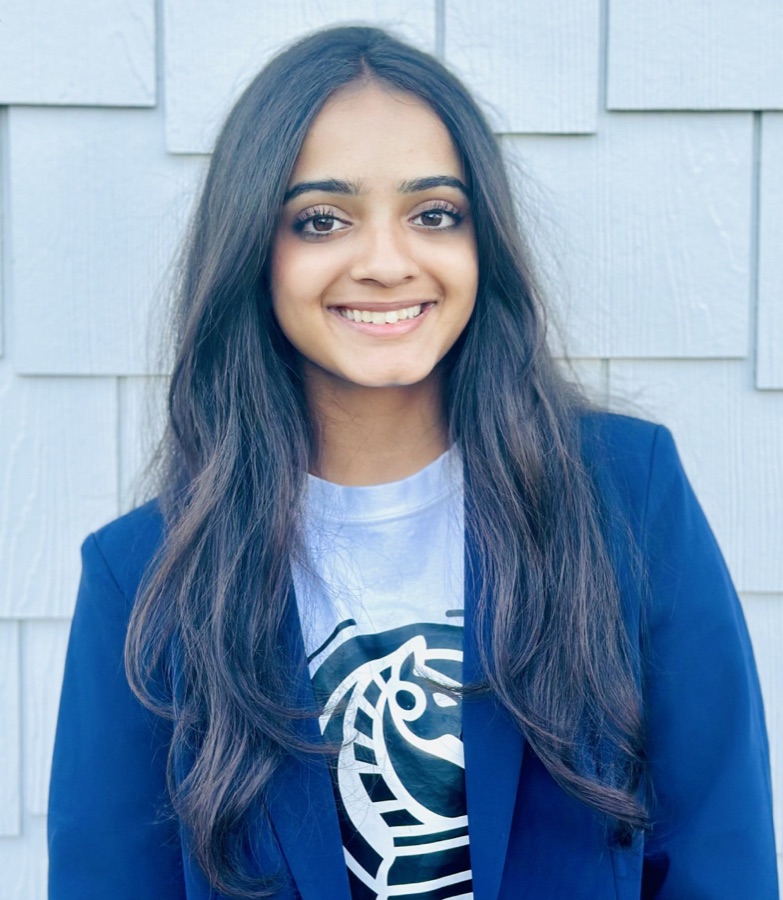 Anaya Gulati, wearing a navy blazer over a Knights of the Future t-shirt.