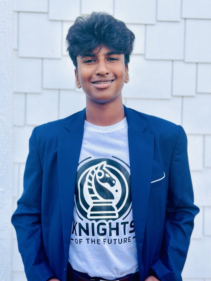 Anish Bandaru, wearing a navy blazer over a Knights of the Future t-shirt.