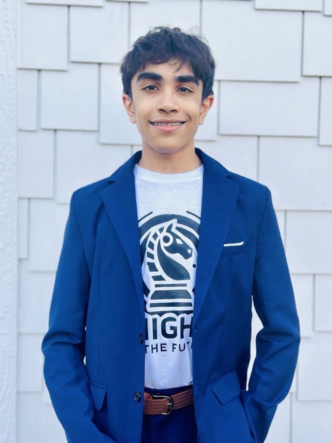 Jai Nagrani, wearing a navy blazer over a Knights of the Future t-shirt.