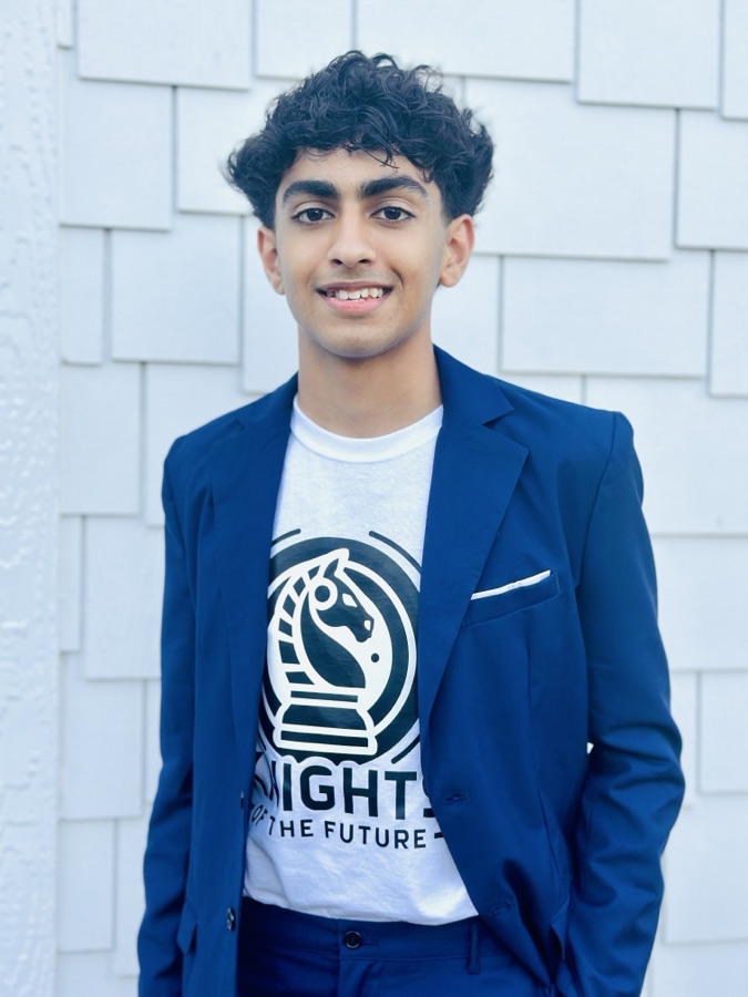 Kalen Gulati, wearing a navy blazer over a Knights of the Future t-shirt.